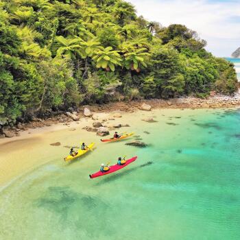 Kayakers by beach